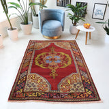 Vintage Turkish rug in a living room setting, pile rug, Turkish rug, vintage rug, portland, rug shop, bright colors, wild shaman, soft rug, bold color, Portland, Oregon, rug store, rug shop, local shop, antique rug