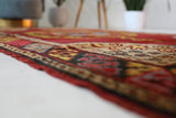 Vintage Turkish rug in a living room setting, pile rug, Turkish rug, vintage rug, portland, rug shop, bright colors, wild shaman, soft rug, bold color, Portland, Oregon, rug store, rug shop, local shop, antique rug