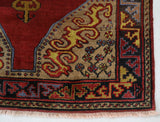 Vintage Turkish rug in a living room setting, pile rug, Turkish rug, vintage rug, portland, rug shop, bright colors, wild shaman, soft rug, bold color, Portland, Oregon, rug store, rug shop, local shop, antique rug