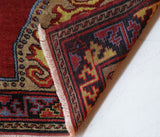 Vintage Turkish rug in a living room setting, pile rug, Turkish rug, vintage rug, portland, rug shop, bright colors, wild shaman, soft rug, bold color, Portland, Oregon, rug store, rug shop, local shop, antique rug
