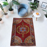 Vintage Turkish rug in a living room setting, pile rug, Turkish rug, vintage rug, portland, rug shop, bright colors, wild shaman, soft rug, bold color, Portland, Oregon, rug store, rug shop, local shop, antique rug