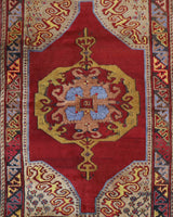 Vintage Turkish rug in a living room setting, pile rug, Turkish rug, vintage rug, portland, rug shop, bright colors, wild shaman, soft rug, bold color, Portland, Oregon, rug store, rug shop, local shop, antique rug
