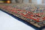 Vintage Turkish rug in a living room setting, pile rug, Turkish rug, vintage rug, portland, rug shop, bright colors, wild shaman, soft rug, bold color, Portland, Oregon, rug store, rug shop, local shop, antique rug