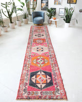 Vintage Turkish runner rug in a living room setting, pile rug, Turkish rug, vintage rug, portland, rug shop, bright colors, wild shaman, soft rug, bold color, Portland, Oregon, rug store, rug shop, local shop
