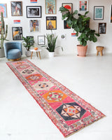 Vintage Turkish runner rug in a living room setting, pile rug, Turkish rug, vintage rug, portland, rug shop, bright colors, wild shaman, soft rug, bold color, Portland, Oregon, rug store, rug shop, local shop