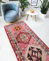Vintage Turkish runner rug in a living room setting, pile rug, Turkish rug, vintage rug, portland, rug shop, bright colors, wild shaman, soft rug, bold color, Portland, Oregon, rug store, rug shop, local shop