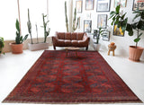 Antique Turkmen rug in a living room setting, pile rug, Turkish rug, vintage rug, portland, rug shop, bright colors, wild shaman, soft rug, bold color, Portland, Oregon, rug store, rug shop, local shop, antique rug