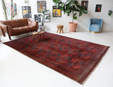 Antique Turkmen rug in a living room setting, pile rug, Turkish rug, vintage rug, portland, rug shop, bright colors, wild shaman, soft rug, bold color, Portland, Oregon, rug store, rug shop, local shop, antique rug