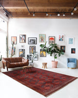 Antique Turkmen rug in a living room setting, pile rug, Turkish rug, vintage rug, portland, rug shop, bright colors, wild shaman, soft rug, bold color, Portland, Oregon, rug store, rug shop, local shop, antique rug