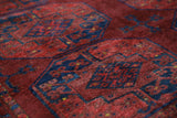 Antique Turkmen rug in a living room setting, pile rug, Turkish rug, vintage rug, portland, rug shop, bright colors, wild shaman, soft rug, bold color, Portland, Oregon, rug store, rug shop, local shop, antique rug