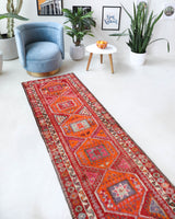 Vintage Turkish runner rug in a living room setting, pile rug, Turkish rug, vintage rug, portland, rug shop, bright colors, wild shaman, soft rug, bold color, Portland, Oregon, rug store, rug shop, local shop