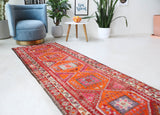 Vintage Turkish runner rug in a living room setting, pile rug, Turkish rug, vintage rug, portland, rug shop, bright colors, wild shaman, soft rug, bold color, Portland, Oregon, rug store, rug shop, local shop