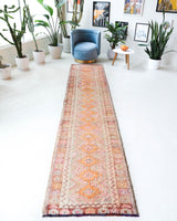 Vintage Turkish runner rug in living room setting, old rug, antique rug, pastel colors, faded colors, Turkish rug, vintage rug, soft rug, Portland, Oregon, rug store, rug shop, local shop