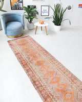 Vintage Turkish runner rug in living room setting, old rug, antique rug, pastel colors, faded colors, Turkish rug, vintage rug, soft rug, Portland, Oregon, rug store, rug shop, local shop