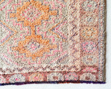 Vintage Turkish runner rug in living room setting, old rug, antique rug, pastel colors, faded colors, Turkish rug, vintage rug, soft rug, Portland, Oregon, rug store, rug shop, local shop