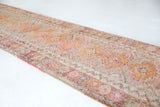 Vintage Turkish runner rug in living room setting, old rug, antique rug, pastel colors, faded colors, Turkish rug, vintage rug, soft rug, Portland, Oregon, rug store, rug shop, local shop
