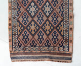 Vintage Turkish runner rug in living room setting, old rug, antique rug, pastel colors, faded colors, Turkish rug, vintage rug, soft rug, Portland, Oregon, rug store, rug shop, local shop