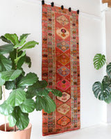 Vintage Turkish runner rug in a living room setting, pile rug, Turkish rug, vintage rug, portland, rug shop, bright colors, wild shaman, soft rug, bold color, Portland, Oregon, rug store, rug shop, local shop