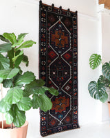 Vintage Turkish runner rug in a living room setting, pile rug, Turkish rug, vintage rug, portland, rug shop, bright colors, wild shaman, soft rug, bold color, Portland, Oregon, rug store, rug shop, local shop