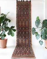 Vintage Turkish runner rug in living room setting, old rug, antique rug, pastel colors, faded colors, Turkish rug, vintage rug, soft rug, Portland, Oregon, rug store, rug shop, local shop