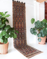 Vintage Turkish runner rug in living room setting, old rug, antique rug, pastel colors, faded colors, Turkish rug, vintage rug, soft rug, Portland, Oregon, rug store, rug shop, local shop