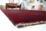 Antique Turkmen rug in a living room setting, pile rug, Turkish rug, vintage rug, portland, rug shop, bright colors, wild shaman, soft rug, bold color, Portland, Oregon, rug store, rug shop, local shop, antique rug