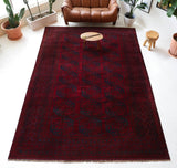Antique Turkmen rug in a living room setting, pile rug, Turkish rug, vintage rug, portland, rug shop, bright colors, wild shaman, soft rug, bold color, Portland, Oregon, rug store, rug shop, local shop, antique rug