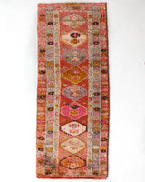 Vintage Turkish runner rug in a living room setting, pile rug, Turkish rug, vintage rug, portland, rug shop, bright colors, wild shaman, soft rug, bold color, Portland, Oregon, rug store, rug shop, local shop