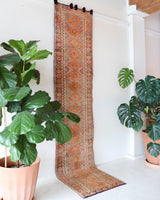 Vintage Turkish runner rug in living room setting, old rug, antique rug, pastel colors, faded colors, Turkish rug, vintage rug, soft rug, Portland, Oregon, rug store, rug shop, local shop