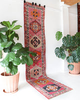 Vintage Turkish runner rug in a living room setting, pile rug, Turkish rug, vintage rug, portland, rug shop, bright colors, wild shaman, soft rug, bold color, Portland, Oregon, rug store, rug shop, local shop
