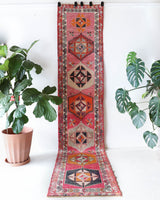 Vintage Turkish runner rug in a living room setting, pile rug, Turkish rug, vintage rug, portland, rug shop, bright colors, wild shaman, soft rug, bold color, Portland, Oregon, rug store, rug shop, local shop