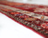 Vintage Turkish runner rug in a living room setting, pile rug, Turkish rug, vintage rug, portland, rug shop, bright colors, wild shaman, soft rug, bold color, Portland, Oregon, rug store, rug shop, local shop,