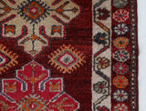 Vintage Turkish runner rug in a living room setting, pile rug, Turkish rug, vintage rug, portland, rug shop, bright colors, wild shaman, soft rug, bold color, Portland, Oregon, rug store, rug shop, local shop,
