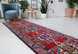Vintage Turkish runner rug in a living room setting, pile rug, Turkish rug, vintage rug, portland, rug shop, bright colors, wild shaman, soft rug, bold color, Portland, Oregon, rug store, rug shop, local shop,