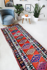 Vintage Turkish runner rug in a living room setting, pile rug, Turkish rug, vintage rug, portland, rug shop, bright colors, wild shaman, soft rug, bold color, Portland, Oregon, rug store, rug shop, local shop,