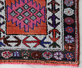 Vintage Turkish runner rug in a living room setting, pile rug, Turkish rug, vintage rug, portland, rug shop, bright colors, wild shaman, soft rug, bold color, Portland, Oregon, rug store, rug shop, local shop,