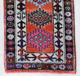 Vintage Turkish runner rug in a living room setting, pile rug, Turkish rug, vintage rug, portland, rug shop, bright colors, wild shaman, soft rug, bold color, Portland, Oregon, rug store, rug shop, local shop,