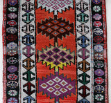 Vintage Turkish runner rug in a living room setting, pile rug, Turkish rug, vintage rug, portland, rug shop, bright colors, wild shaman, soft rug, bold color, Portland, Oregon, rug store, rug shop, local shop,