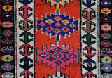 Vintage Turkish runner rug in a living room setting, pile rug, Turkish rug, vintage rug, portland, rug shop, bright colors, wild shaman, soft rug, bold color, Portland, Oregon, rug store, rug shop, local shop,
