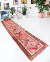 Vintage Turkish runner rug in living room setting, old rug, antique rug, pastel colors, faded colors, Turkish rug, vintage rug, soft rug, Portland, Oregon, rug store, rug shop, local shop