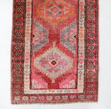 Vintage Turkish runner rug in living room setting, old rug, antique rug, pastel colors, faded colors, Turkish rug, vintage rug, soft rug, Portland, Oregon, rug store, rug shop, local shop