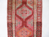 Vintage Turkish runner rug in living room setting, old rug, antique rug, pastel colors, faded colors, Turkish rug, vintage rug, soft rug, Portland, Oregon, rug store, rug shop, local shop