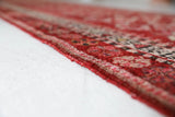 Vintage Turkish runner rug in a living room setting, pile rug, Turkish rug, vintage rug, portland, rug shop, bright colors, wild shaman, soft rug, bold color, Portland, Oregon, rug store, rug shop, local shop
