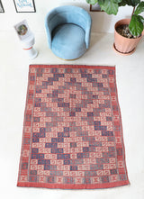 Vintage kilim rug in room decor setting, old rug, antique rug, pastel colors, faded colors, Turkish rug, vintage rug, soft rug, Portland, Oregon, rug store, rug shop, local shop, bold colors, bright colors, faded colors