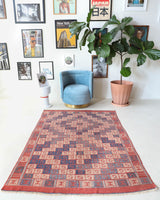 Vintage kilim rug in room decor setting, old rug, antique rug, pastel colors, faded colors, Turkish rug, vintage rug, soft rug, Portland, Oregon, rug store, rug shop, local shop, bold colors, bright colors, faded colors