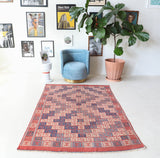 Vintage kilim rug in room decor setting, old rug, antique rug, pastel colors, faded colors, Turkish rug, vintage rug, soft rug, Portland, Oregon, rug store, rug shop, local shop, bold colors, bright colors, faded colors