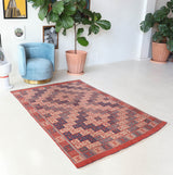 Vintage kilim rug in room decor setting, old rug, antique rug, pastel colors, faded colors, Turkish rug, vintage rug, soft rug, Portland, Oregon, rug store, rug shop, local shop, bold colors, bright colors, faded colors