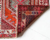 Vintage Turkish runner rug in a living room setting, pile rug, Turkish rug, vintage rug, portland, rug shop, bright colors, wild shaman, soft rug, bold color, Portland, Oregon, rug store, rug shop, local shop,