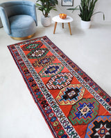 Vintage Turkish runner rug in a living room setting, pile rug, Turkish rug, vintage rug, portland, rug shop, bright colors, wild shaman, soft rug, bold color, Portland, Oregon, rug store, rug shop, local shop