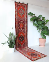 Vintage Turkish runner rug in a living room setting, pile rug, Turkish rug, vintage rug, portland, rug shop, bright colors, wild shaman, soft rug, bold color, Portland, Oregon, rug store, rug shop, local shop